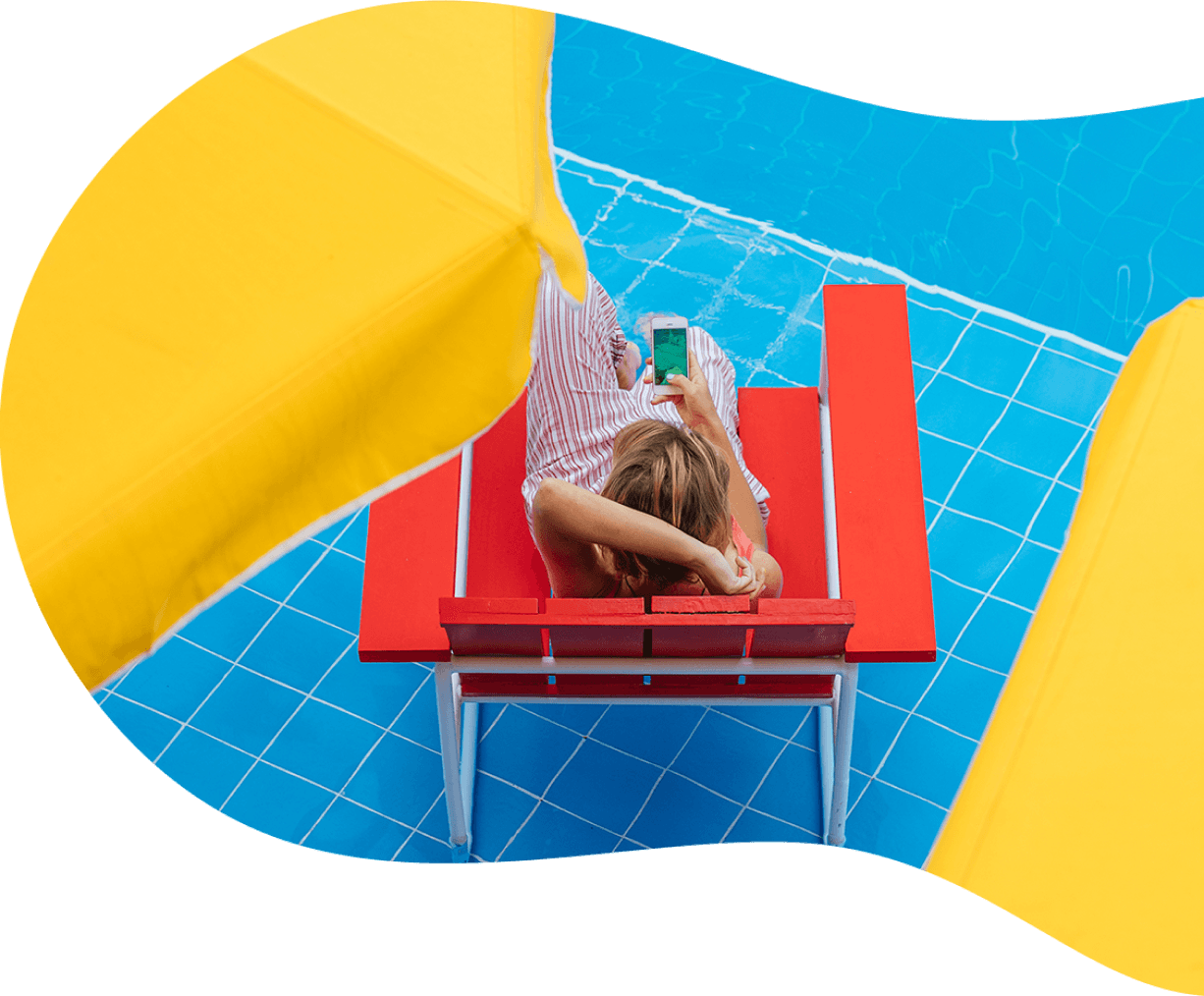 Woman relaxing in the pool and using her phone