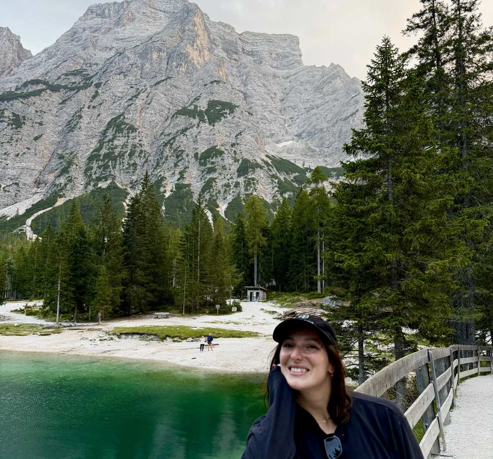 author in front of mountains